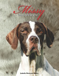 Capa do livro mostra a cachorra branca e marrom, Missy.